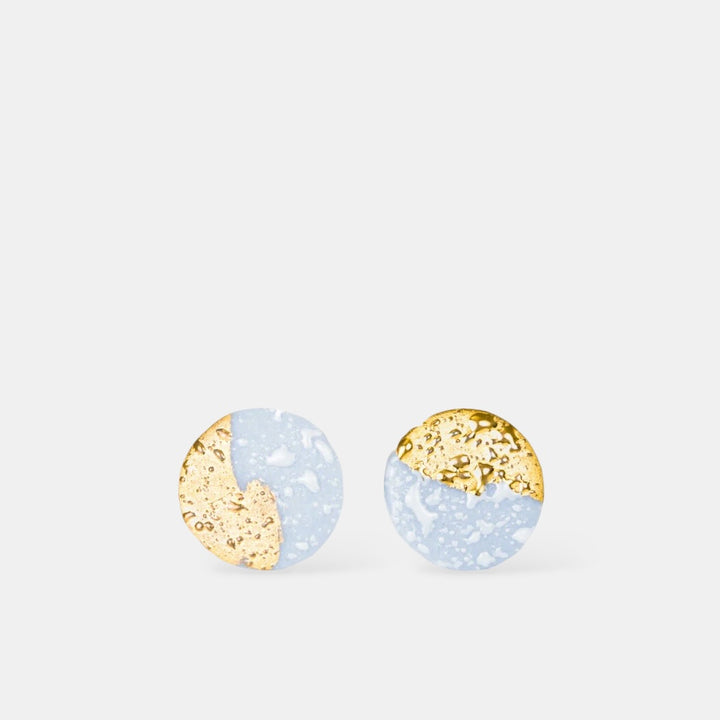 Pair of round  porcelain earrings with gold and light blue design by freakyfoxx on a white background