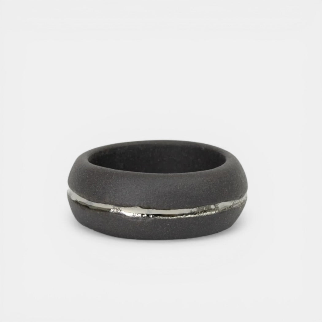 Black ring with a silver accent by freakyfoxx on a white background
