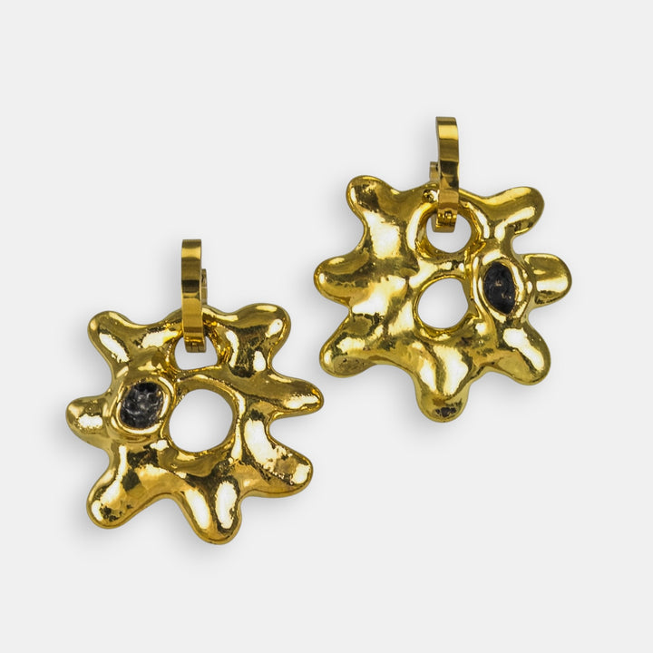 Two gold sun-shaped porcelain charms with hoop by freakyfoxx on a white background