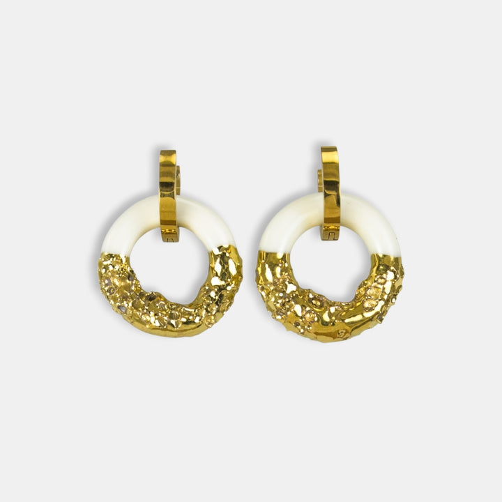 Pair of gold hoop earrings with white porcelain charm plated with gold by freakyfoxx on  light gray background