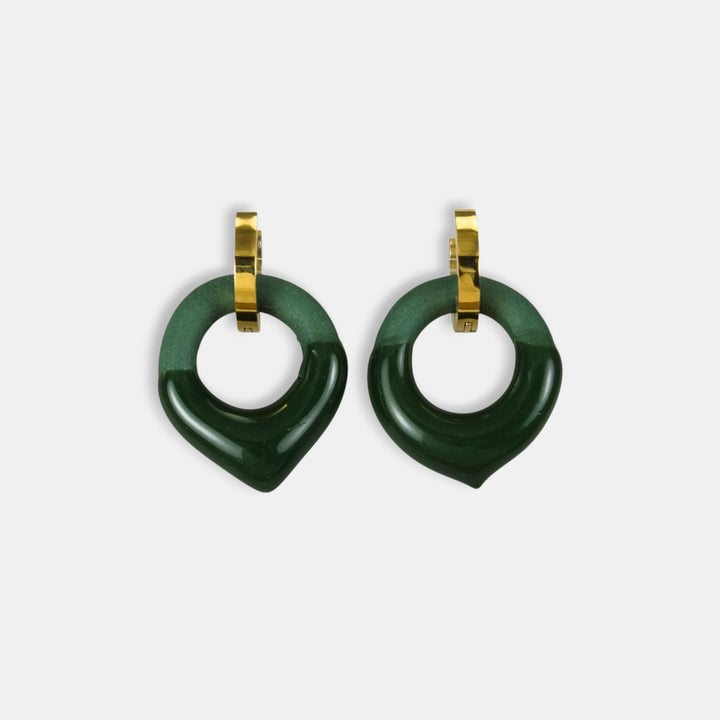 Pair of green handmade charm earrings with gold hoop by freakyfoxx on a white background