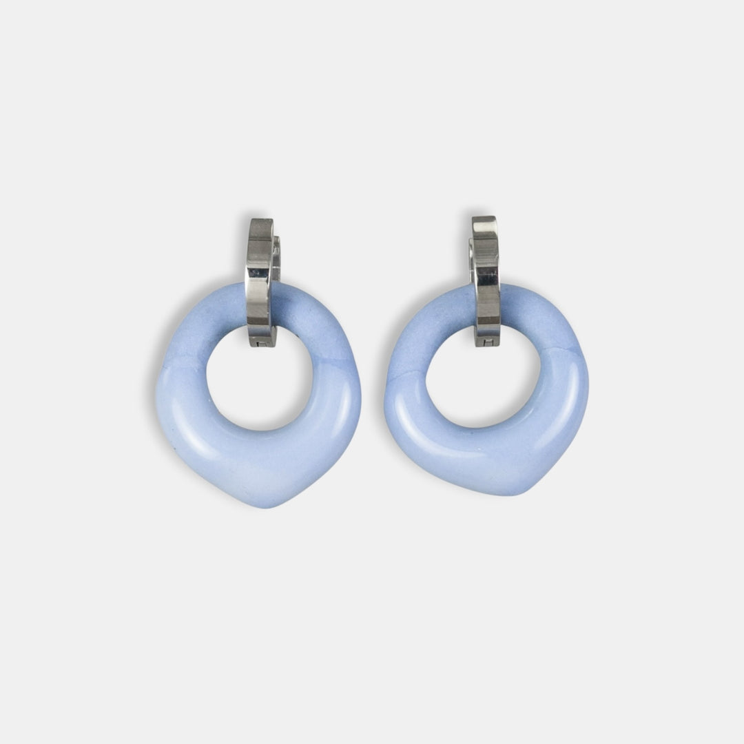 Pair of light blue porcelain charms with medical steel hoop by freakyfoxx on a white background