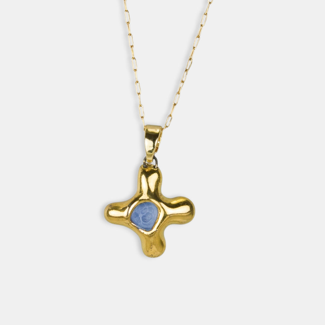 Gold cross pendant with a blue porcelain by FreakyFoxx on a white background