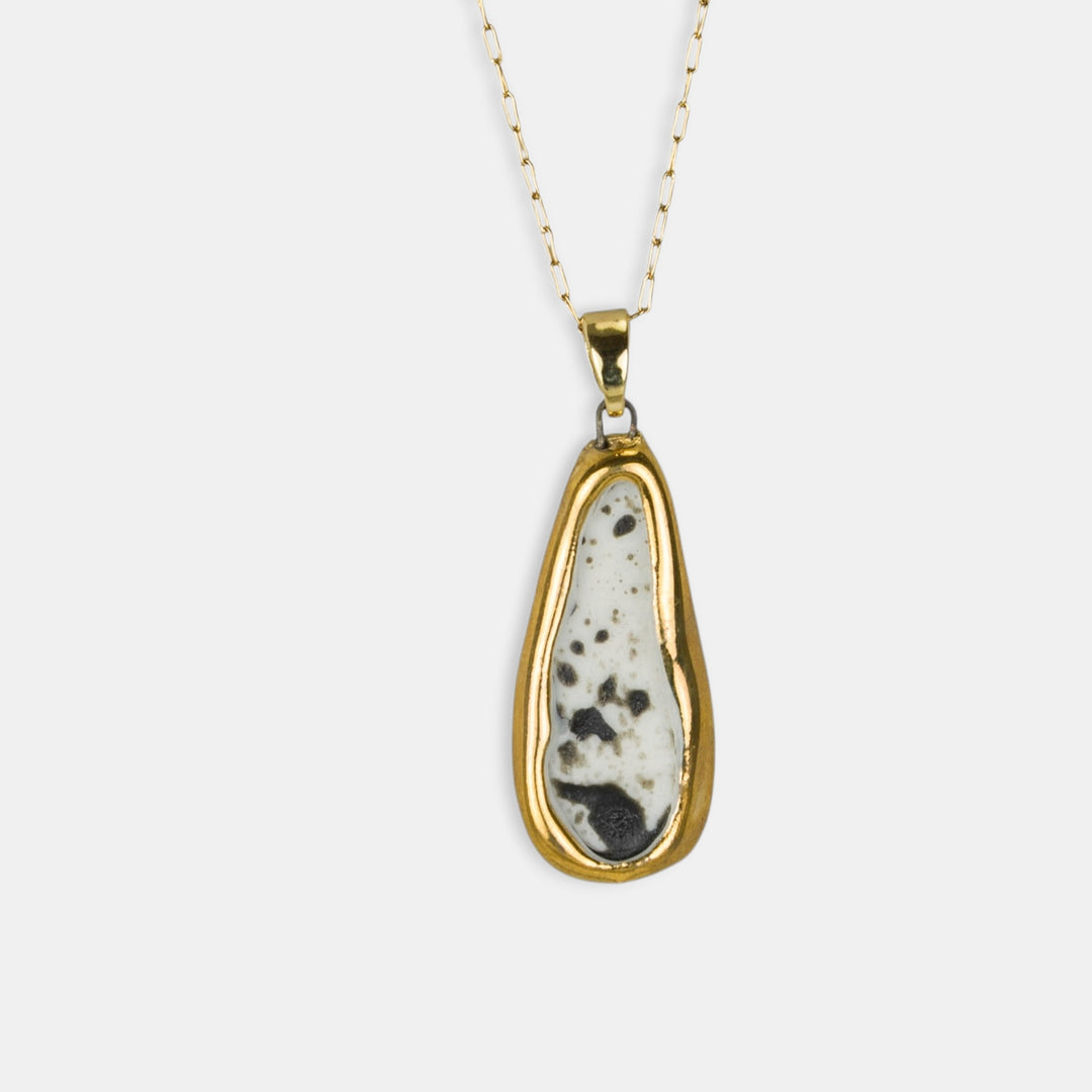 Golg plated porcelain pendant on gold chain by FreakyFoxx