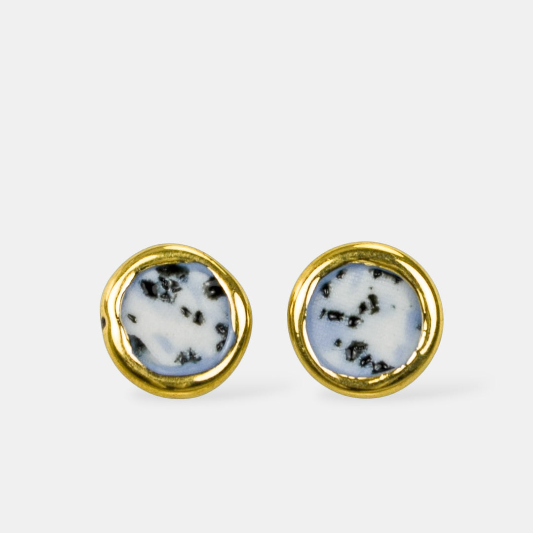 Round porcelain earrings with gold rims and dalmatian jasper stones on a white background by freakyfoxx