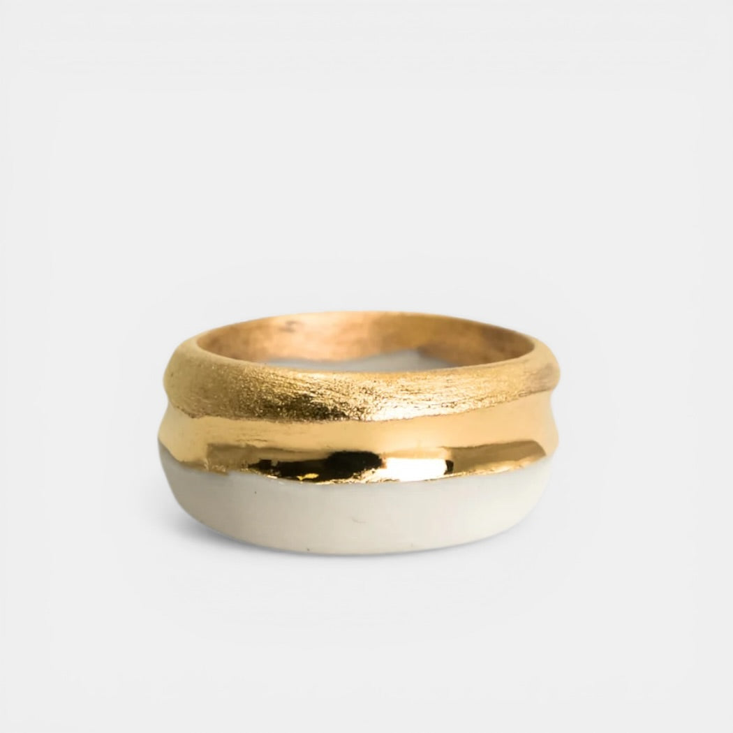 white matte ring with a textured gold design by freakyfoxx on a light gray background