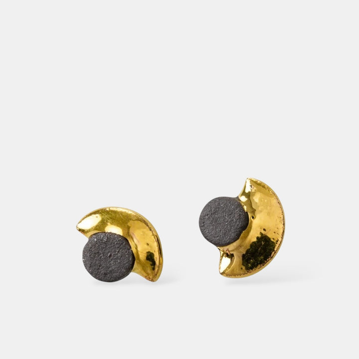 Gold and black half-circle earrings by freakyfoxx on a white background