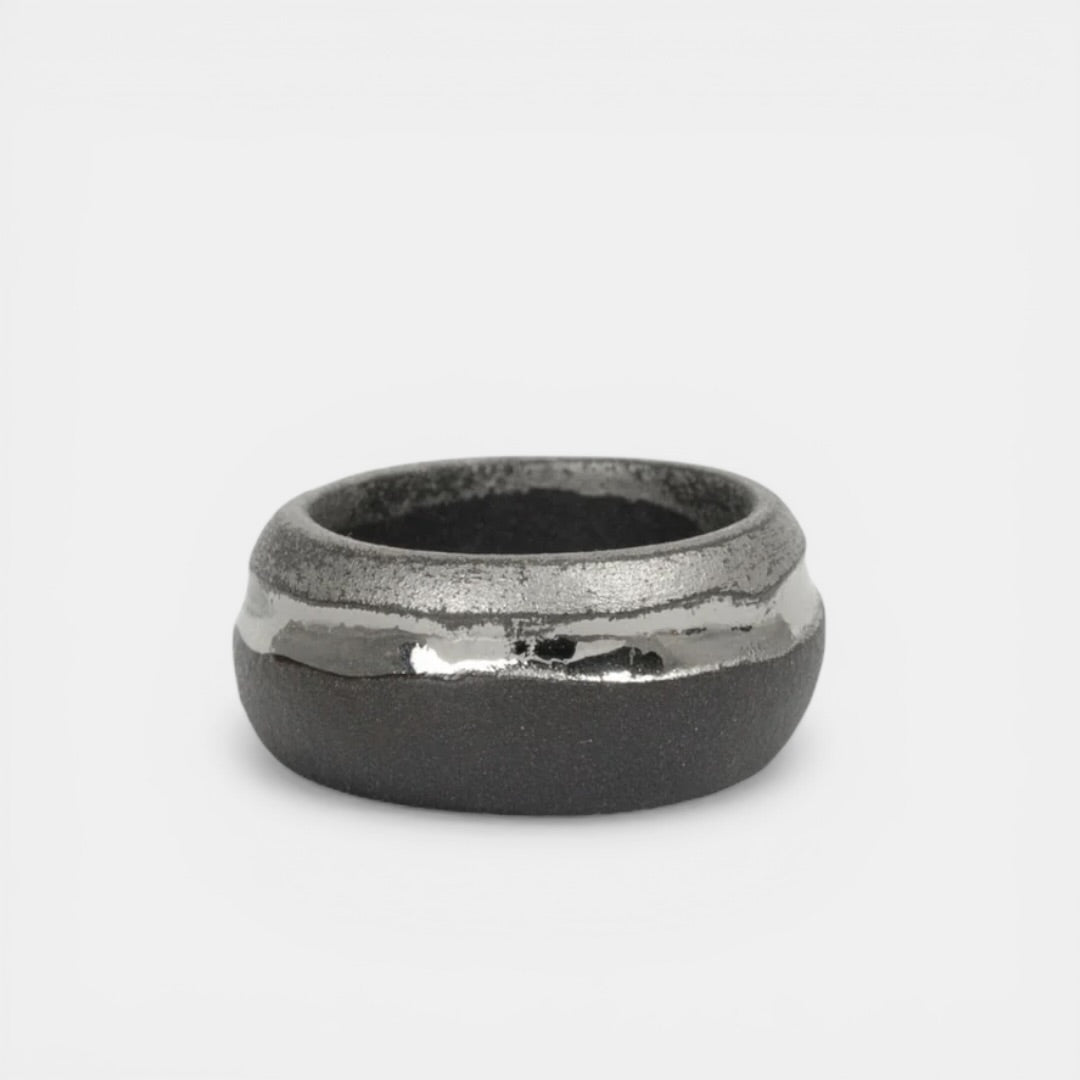 black porcelain ring with a matte surface by freakyfoxx on a light gray background