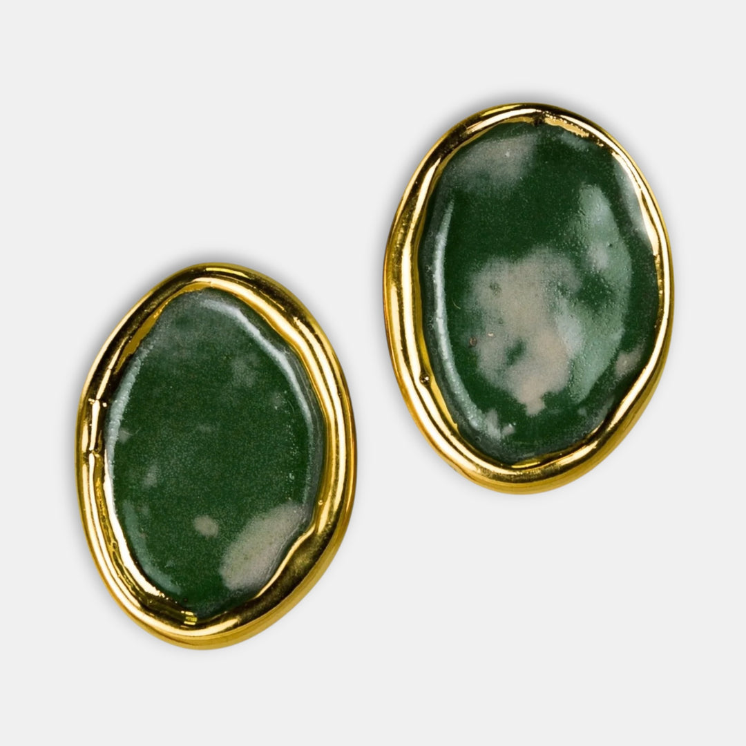 Pair of earrings with green porcelain and gold rims on a white background by freakyfoxx