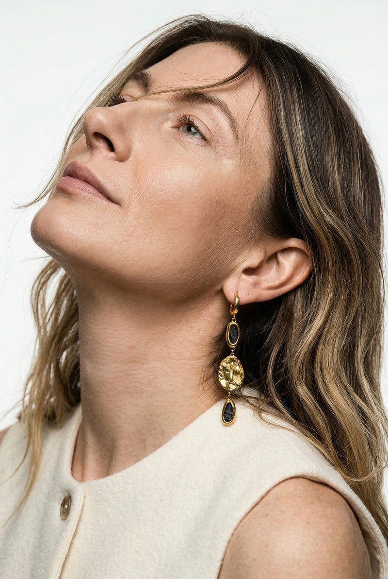 Algina Midvere is  wearing porcelain earringsby freakyfoxx