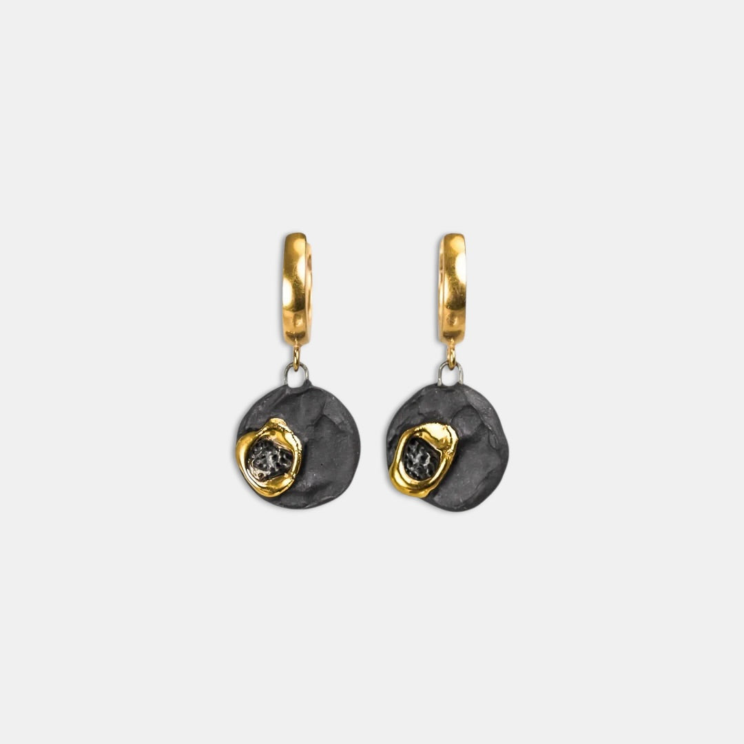 Pair of handmade earrings with gold and black design by freakyfoxx