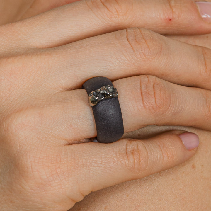 black matte porcelain ring with silver on hand by freakyfoxx