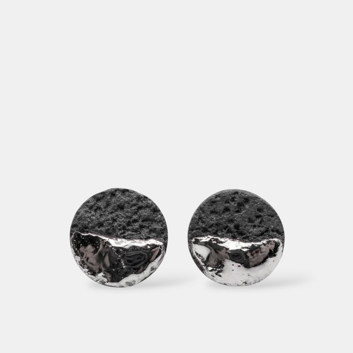 Pair of round black porcelain earrings with silver by freakyfoxx on a white background
