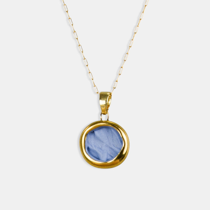 Gold necklace with a blue porcelain pendant by freakyfoxx on a white background