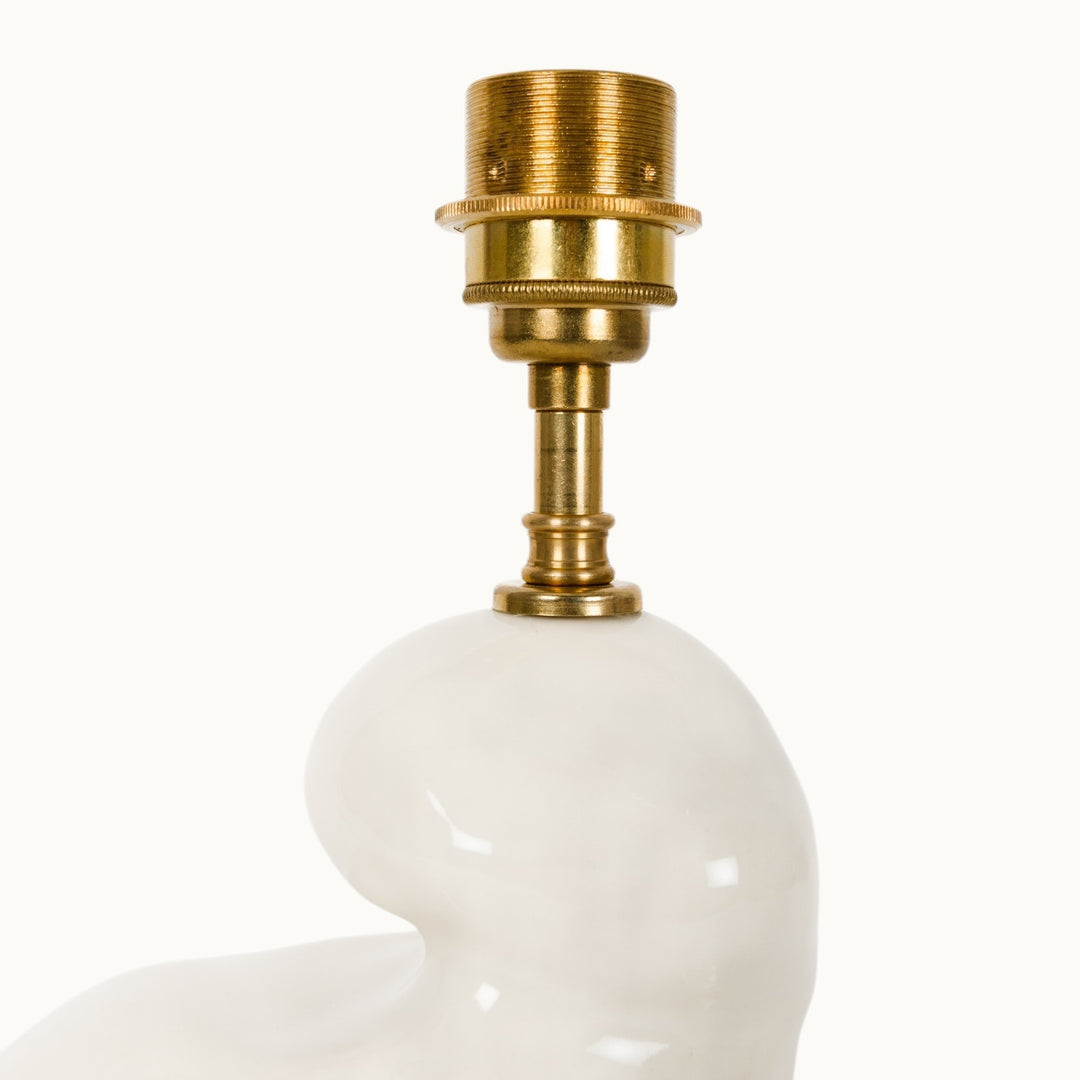 Close-up of the ceramic lamp base with a brass light socket. A modern, handcrafted lamp perfect for stylish home decor.