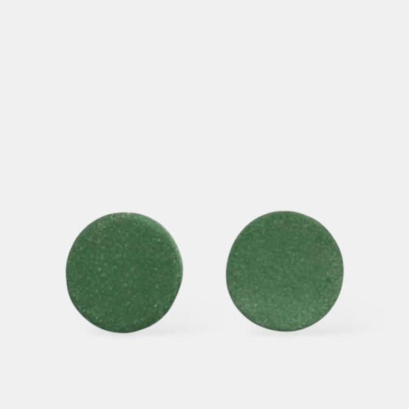 Pair of green round earrings  from porcelain on a white background