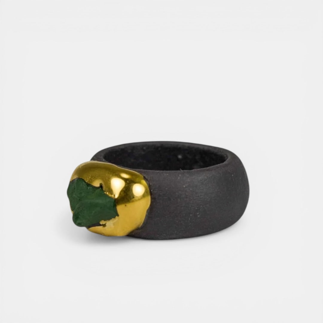 Black porcelain ring with gold and green accents by freakyfoxx on a white background