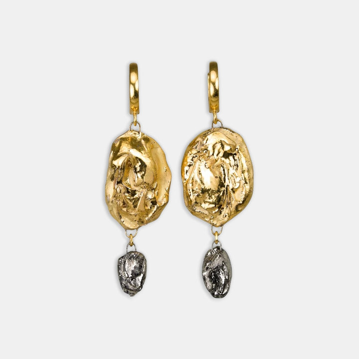 Pair of gold earrings with textured design by freakyfoxx