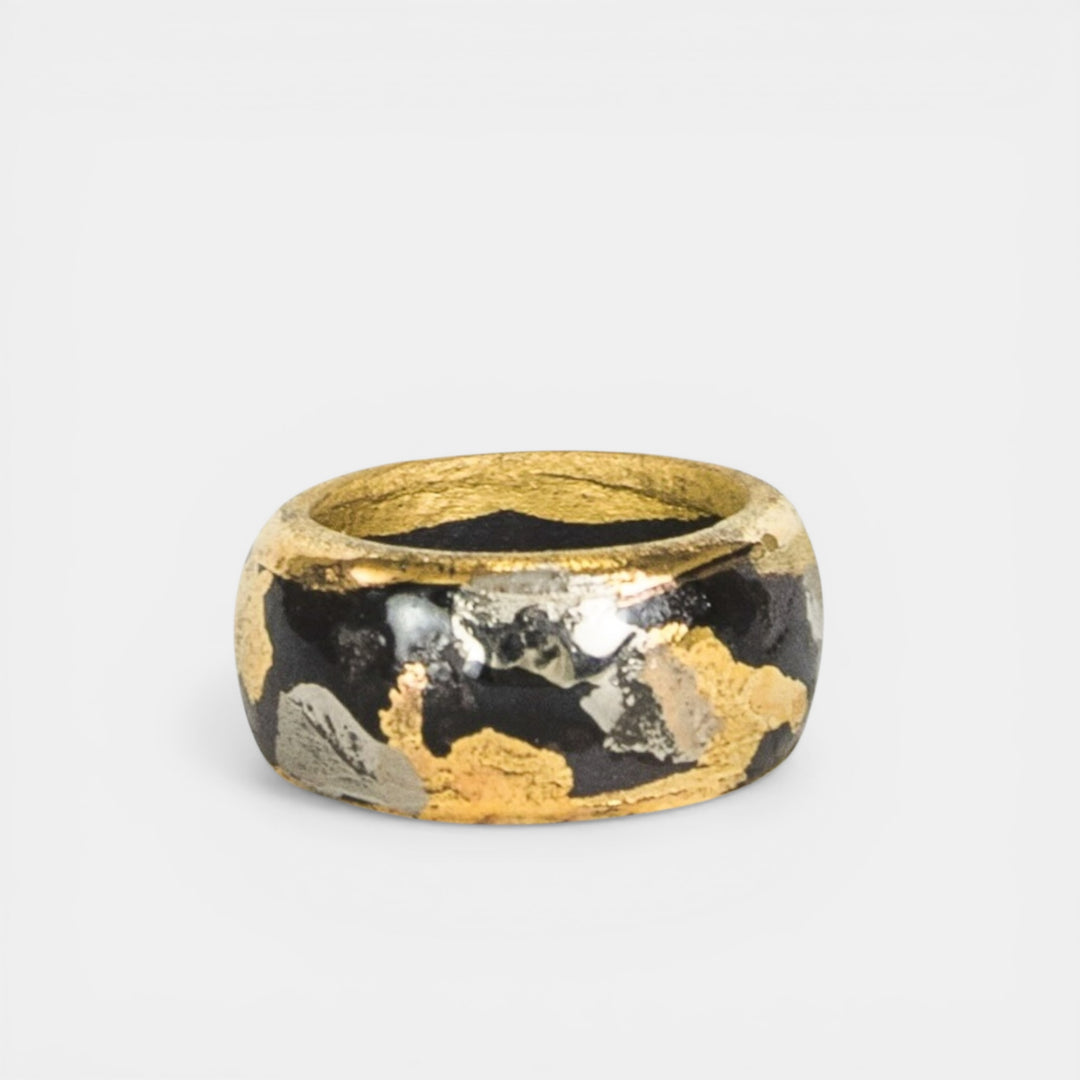 Gold and black porcelain ring by freakyfoxx on a light gray background