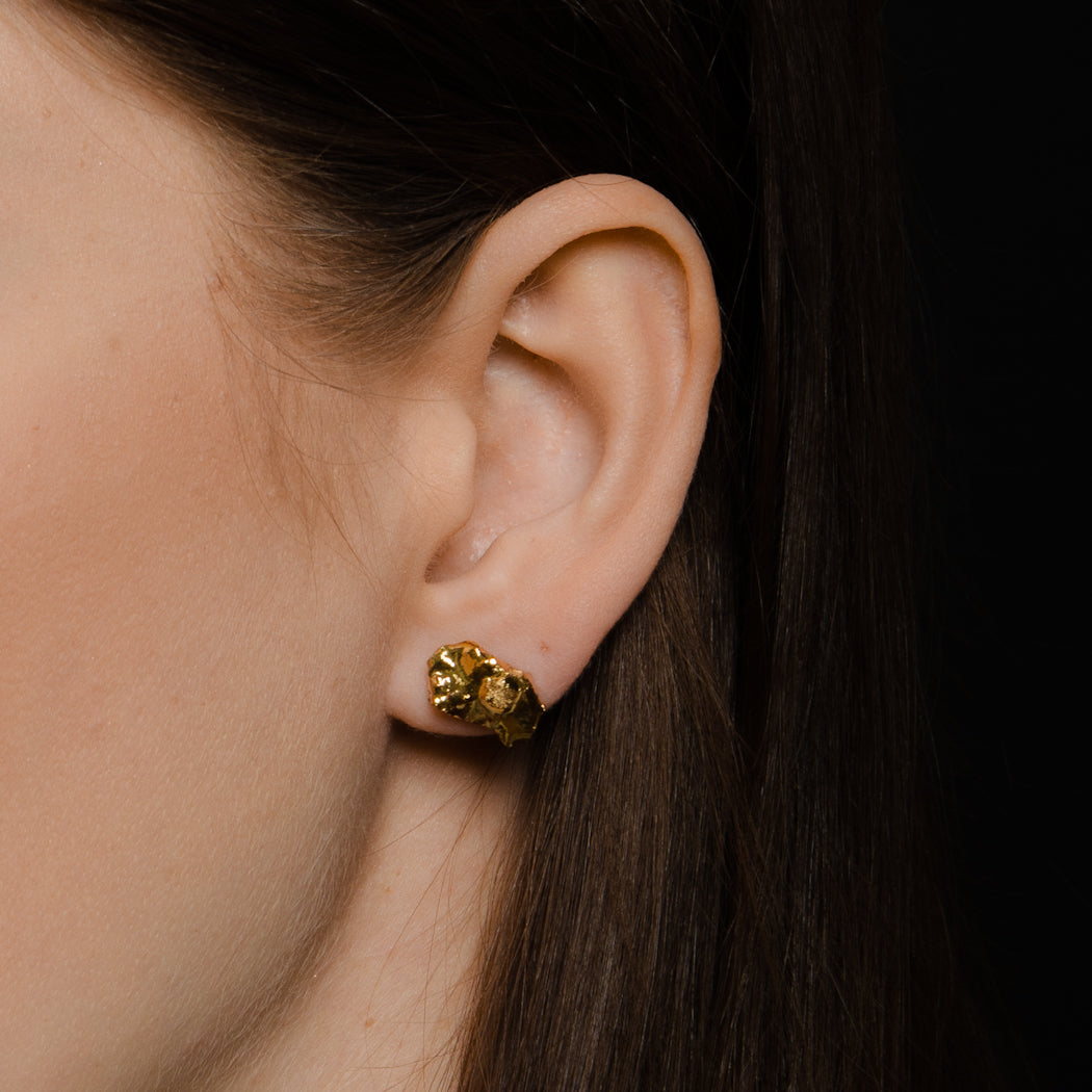 Gold porcelain stud earrings. 